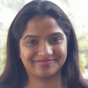 Headshot of a woman with long dark hair.